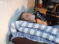 Girl In A Catsuit Hogtied In The Basement
