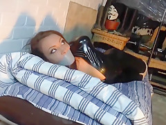 Girl In A Catsuit Hogtied In The Basement